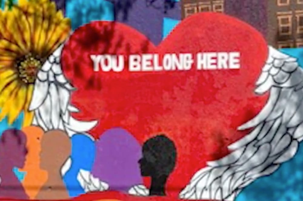 Counseling In Schools helps parents, famlies and guardians. Wall mural painted by students of a heart with the words You Belong Here