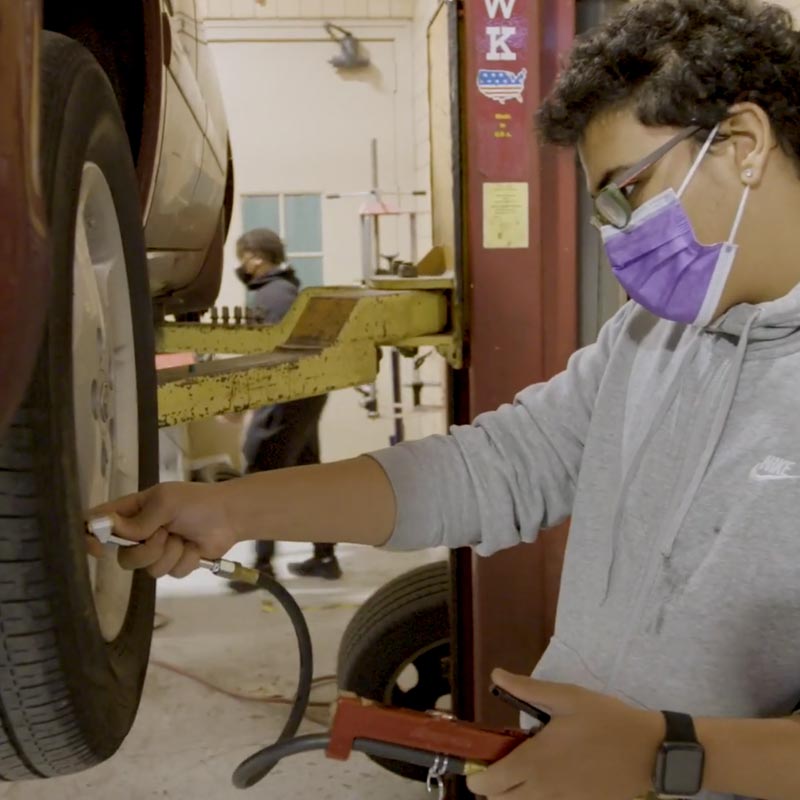 Counseling in Schools student working on automotive